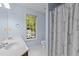 Bright bathroom with double vanity sinks, natural light, and a separate toilet at 3401 Scotch Dr, Raleigh, NC 27616