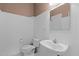 Bright half bathroom with white wainscoting, vanity, and updated fixtures at 3401 Scotch Dr, Raleigh, NC 27616