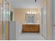 This bathroom features a double vanity, and shower with natural light from the window at 3401 Scotch Dr, Raleigh, NC 27616