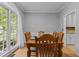 Classic dining room with a large window and light-colored walls, perfect for Gathering gatherings at 3401 Scotch Dr, Raleigh, NC 27616