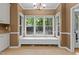 Eat-in kitchen area with natural light, backyard view, and built-in window bench at 3401 Scotch Dr, Raleigh, NC 27616