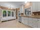 Well-lit kitchen featuring stainless steel appliances, granite countertops, and ample cabinet space at 3401 Scotch Dr, Raleigh, NC 27616