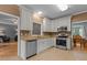 Well-equipped kitchen with stainless steel appliances, granite countertops, and ample counter space at 3401 Scotch Dr, Raleigh, NC 27616