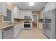 The kitchen features stainless steel appliances, granite countertops, and ample storage space at 3401 Scotch Dr, Raleigh, NC 27616