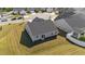 Aerial view of a home with a well-maintained lawn and gray siding at 36 High View Ct, Fuquay Varina, NC 27526