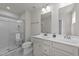 Bathroom featuring a double sink vanity with white countertop and a glass-enclosed shower at 36 High View Ct, Fuquay Varina, NC 27526