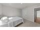 Well-lit carpeted bedroom features a queen bed, neutral walls and a doorway at 36 High View Ct, Fuquay Varina, NC 27526