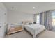 Bright bedroom with a bed, a crib and two windows with patterned curtains at 36 High View Ct, Fuquay Varina, NC 27526