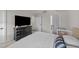 Spacious bedroom with dark dresser, connecting doors, a crib and carpet flooring at 36 High View Ct, Fuquay Varina, NC 27526