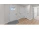 Entryway featuring a front door, wood-look flooring, and white trim at 36 High View Ct, Fuquay Varina, NC 27526