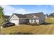 Charming single-Gathering home with a gray exterior, well-maintained lawn, and a two-car garage at 36 High View Ct, Fuquay Varina, NC 27526