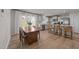 Open-concept kitchen boasts stainless appliances, light gray cabinets, an island and a dining area at 36 High View Ct, Fuquay Varina, NC 27526