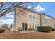 View of backyard, showcasing a small patio area and mature trees at 4007 Newell Ln, Raleigh, NC 27616
