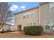 Backyard with a patio, manicured greenery, and multiple windows at 4007 Newell Ln, Raleigh, NC 27616