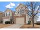 Charming exterior of home featuring attached garage, and manicured landscaping at 4007 Newell Ln, Raleigh, NC 27616