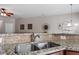 Modern kitchen featuring granite countertops, stainless steel sink, and warm wood cabinets at 4007 Newell Ln, Raleigh, NC 27616