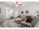 The comfortable living room features a ceiling fan, stylish decor, and a large sectional sofa at 4007 Newell Ln, Raleigh, NC 27616