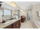 Bathroom features double vanities with granite countertops and tile flooring at 401 Clingstone Ct, Cary, NC 27519