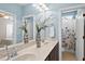 Bright bathroom boasting double sinks, modern fixtures, and a separate shower area at 401 Clingstone Ct, Cary, NC 27519