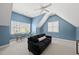 Comfortable bonus room with a seating area, and ample light at 401 Clingstone Ct, Cary, NC 27519