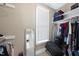 Walk-in closet with shelves, storage and full length mirror at 401 Clingstone Ct, Cary, NC 27519