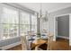 Sunlit dining area with a stylish light fixture and plenty of natural light at 401 Clingstone Ct, Cary, NC 27519