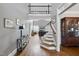Spacious foyer with wood floors, staircase, and decor at 401 Clingstone Ct, Cary, NC 27519