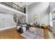 Spacious living room with soaring ceilings, hardwood floors and staircase at 401 Clingstone Ct, Cary, NC 27519