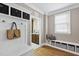 Welcoming mudroom features storage bench and convenient access to the kitchen at 401 Clingstone Ct, Cary, NC 27519