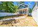 Charming blue home featuring a spacious backyard and a stylish walkway to a wooden porch at 407 1/2 Carolina Ave, Raleigh, NC 27606