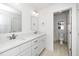 Bright bathroom features double sink vanity with quartz countertops and access to the toilet and shower at 407 1/2 Carolina Ave, Raleigh, NC 27606