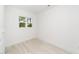 Bright bedroom with a neutral color scheme, single window, and light tile flooring at 407 1/2 Carolina Ave, Raleigh, NC 27606