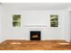 Living room has a fireplace between two windows at 407 1/2 Carolina Ave, Raleigh, NC 27606