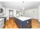 Bright kitchen features a large island, modern appliances, and white cabinetry at 407 1/2 Carolina Ave, Raleigh, NC 27606