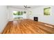 Living room with a fireplace, ceiling fan, and sliding door leading to the backyard at 407 1/2 Carolina Ave, Raleigh, NC 27606