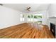 Living room with a ceiling fan and a fireplace, also includes sliding doors to the backyard at 407 1/2 Carolina Ave, Raleigh, NC 27606