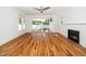 Bright living room boasts a fireplace and sliding glass doors opening to the back yard at 407 1/2 Carolina Ave, Raleigh, NC 27606