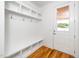 Mudroom with built-in bench and storage cubbies and hooks, perfect for organization at 407 1/2 Carolina Ave, Raleigh, NC 27606