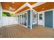 Covered porch with wood ceiling, ceiling fan, and sliding glass doors at 407 1/2 Carolina Ave, Raleigh, NC 27606