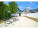 Rear exterior featuring white vinyl privacy fence and backyard access at 407 1/2 Carolina Ave, Raleigh, NC 27606