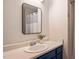 Bathroom with a single sink vanity, a modern mirror and a shower with a curtain at 4713 Little Falls Dr, Raleigh, NC 27609