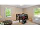Bright bedroom with a loft bed, desk and lots of natural light at 4713 Little Falls Dr, Raleigh, NC 27609
