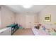 Bright bedroom with lots of toys, colorful decor, a closet, and plenty of natural light at 4713 Little Falls Dr, Raleigh, NC 27609