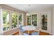 Cozy breakfast nook featuring a round table, light-colored chairs, and natural light at 4713 Little Falls Dr, Raleigh, NC 27609