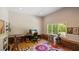 Bright home office featuring a music workstation, vibrant rug, and natural light from a large window at 4713 Little Falls Dr, Raleigh, NC 27609