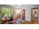 Bright office space with large window, desk and a colorful area rug at 4713 Little Falls Dr, Raleigh, NC 27609