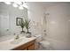Clean bathroom featuring a vanity, toilet, and shower/tub combo at 4812 Cornoustie Ct, Holly Springs, NC 27540