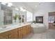 Elegant bathroom with double sinks, jacuzzi tub with fireplace, and a separate glass-enclosed shower at 4812 Cornoustie Ct, Holly Springs, NC 27540