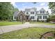 Attractive home with a combination of brick and white siding, highlighted by well-manicured landscaping and an inviting entrance at 4812 Cornoustie Ct, Holly Springs, NC 27540