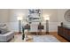 Sitting area featuring a desk, lamps, and modern art on the wall at 4812 Cornoustie Ct, Holly Springs, NC 27540